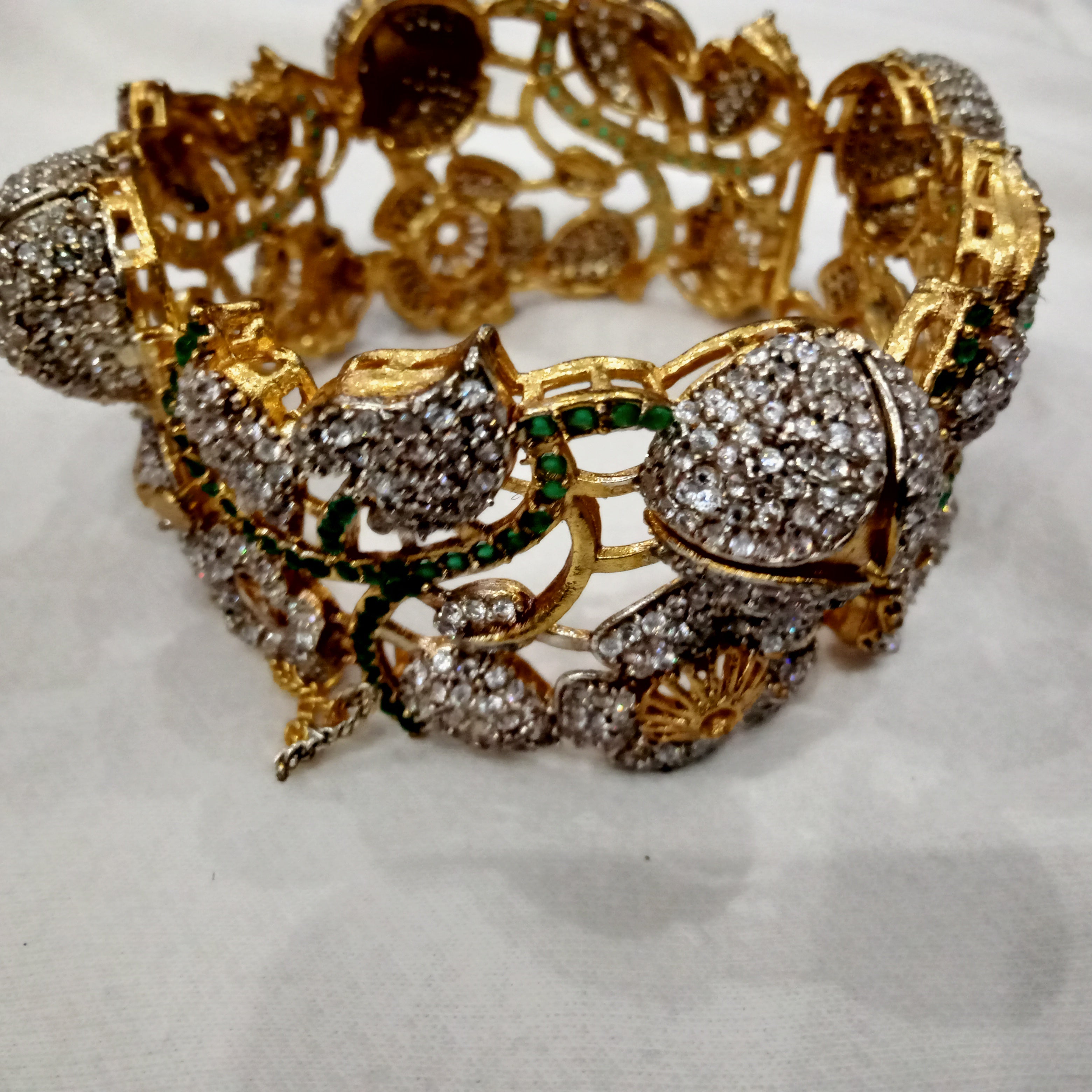 Antique Gold Plated Floral Bracelet with White Stones and Green Meenakari
