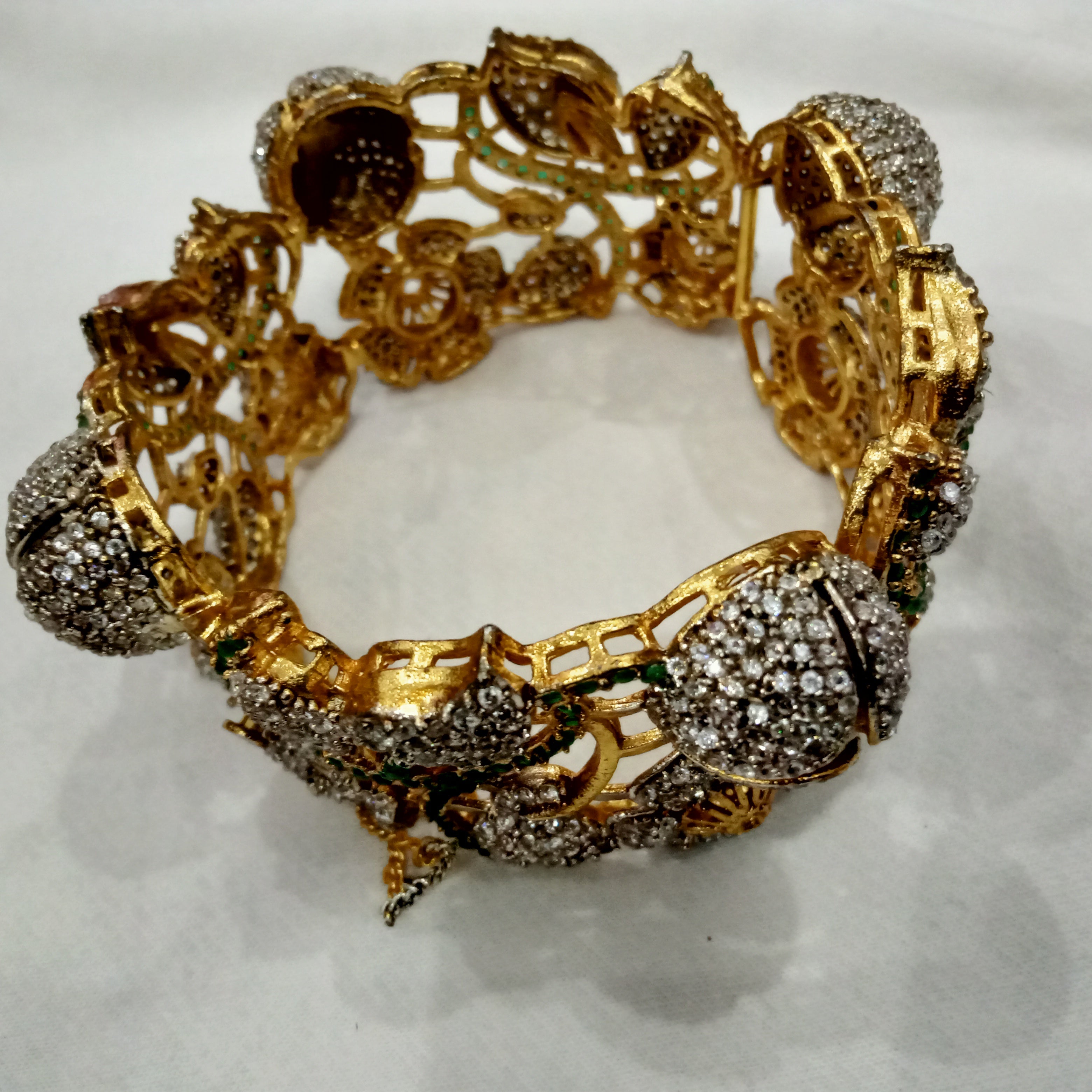 Antique Gold Plated Floral Bracelet with White Stones and Green Meenakari